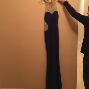 I'm selling a navy blue, elegant dress.