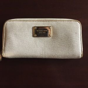White Michael Kors wallet.