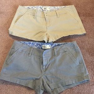 Two American Eagle stretch shorts. khaki and Gray.