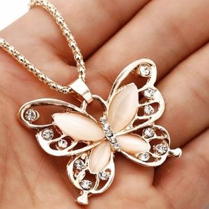 Never used butterfly necklace. Great for a gift .