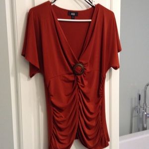 Silky burnt orange top w/ bronze detail