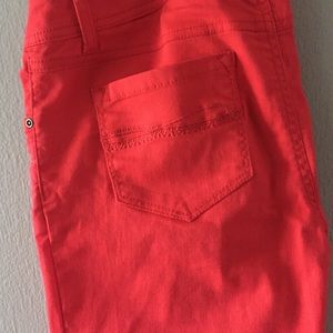 Red-orange, stretchy pants