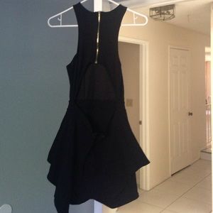 Black knee length open lower back dress