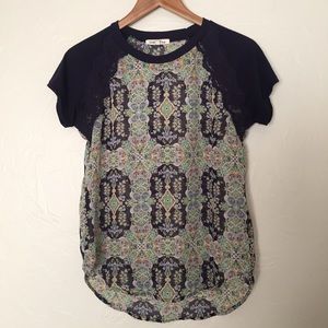 Cute, navy and sheer patterned top!