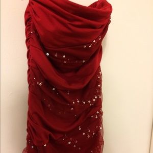 Goes down to mid thigh. Pretty soft fabric