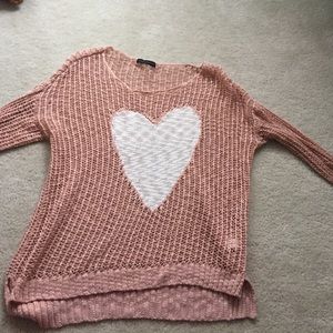 a sweater with a heart in the middle