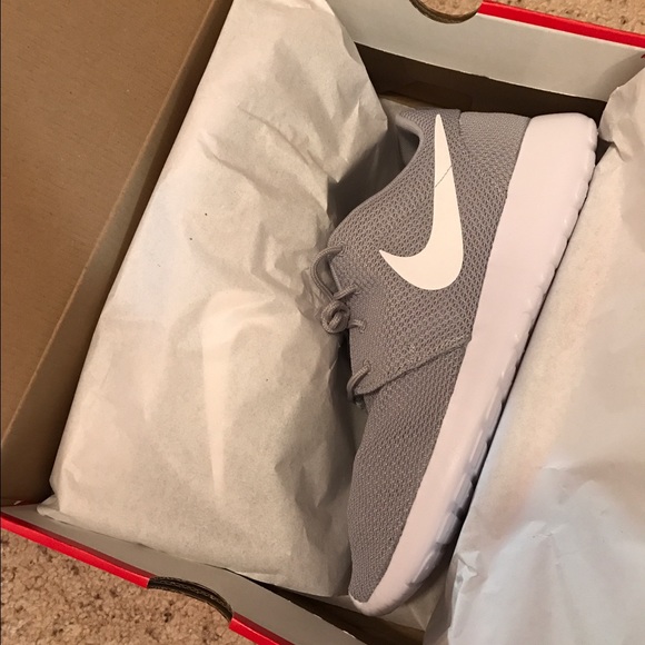 Gray Nike roshes