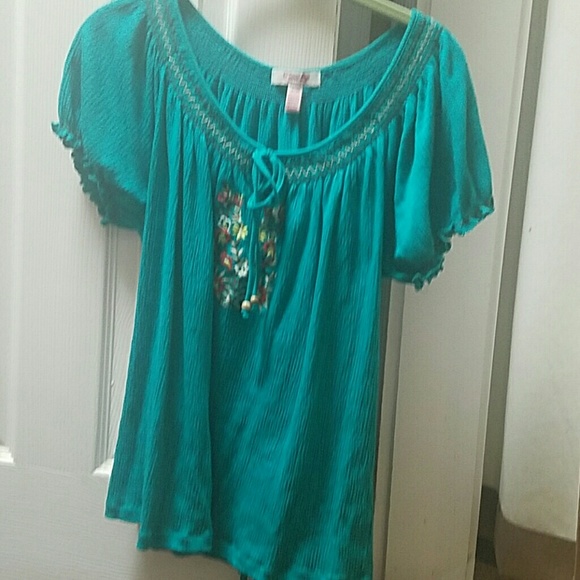 Blue blouse with flower patterns