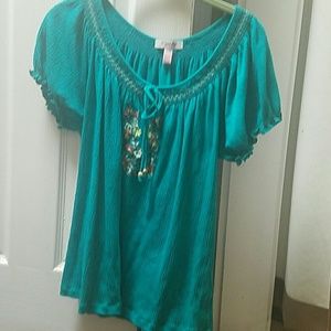 Blue blouse with flower patterns