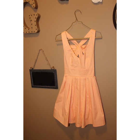 Peach V-neck dress with bow on back