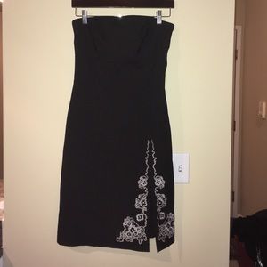 Strapless black dress with accented slit