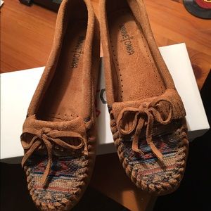 Never worn Minnetonka tan, suede moccasins.