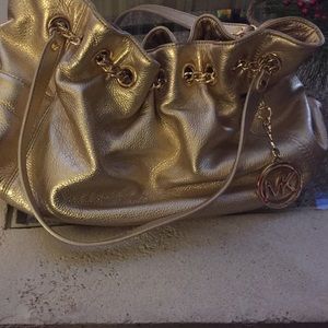 Michael Kors gold handbag