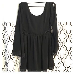 Black long sleeve, lace open side dress.