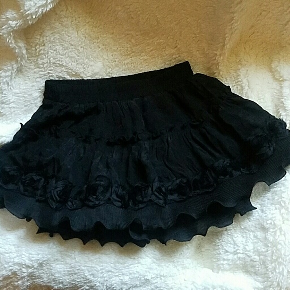 Black ruffle mini skirt