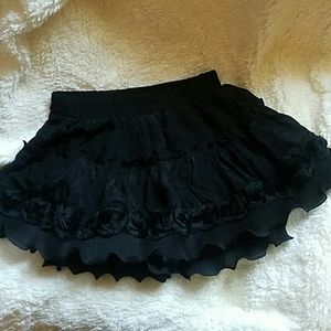 Black ruffle mini skirt