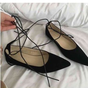 Strapping black flats