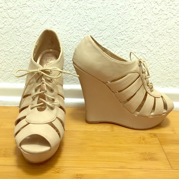 Nude lace up wedges.
