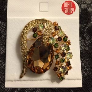 Fashion statement goldtone amber color gem brooch