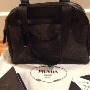 Grey flannel and leather Prada satchel.