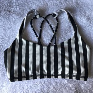 White and black sports bra. Pads can be requested