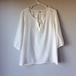 Flowy cream blouse with cut out/tie
