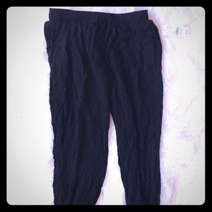 Black joggers. Tags still on. PAC SUN