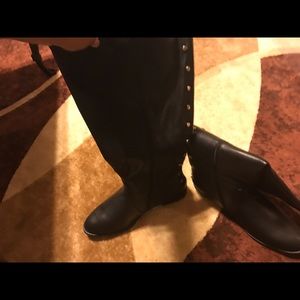 Black riding boots with gold studs on back