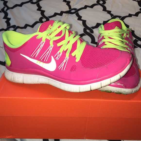 Neon yellow and pink Nike free 5.0 tennis shoes