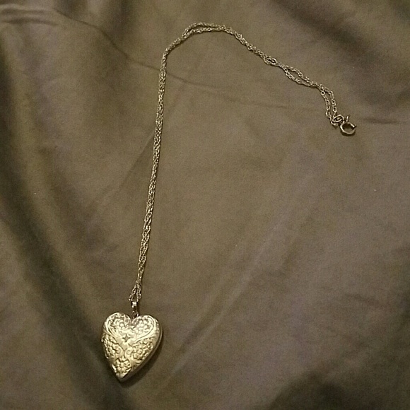 NWOT Locket with 4 photo holder
