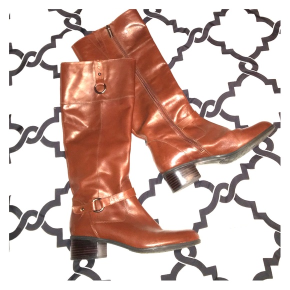 Dark brown tall riding boots.