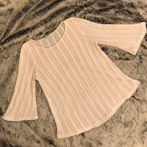 Cream knit top.