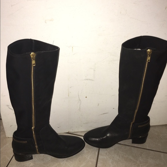 Black tall boots with gold zipper