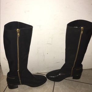 Black tall boots with gold zipper