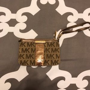 Michael Kors monogram wristlet w rose gold sequins