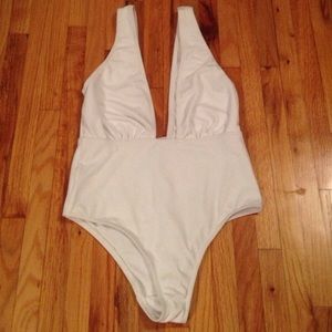 White ASOS one piece swimsuit with plunge neckline
