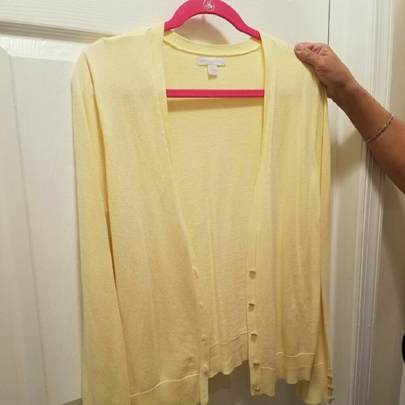 Yellow cardigan with jeweled buttons