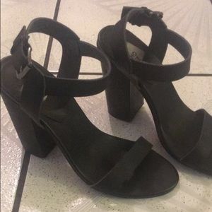 We Who See black block heels.