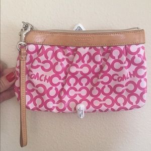 Pink patent coach wristlet