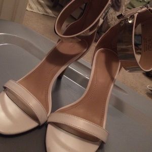 White heels with silver plate accent.