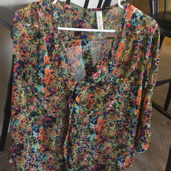 Paint splattered sheer long-sleeve blouse