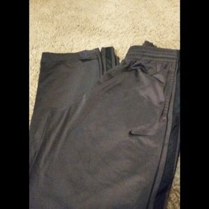 Mens Nike pants. Small Dark grey with black stripe