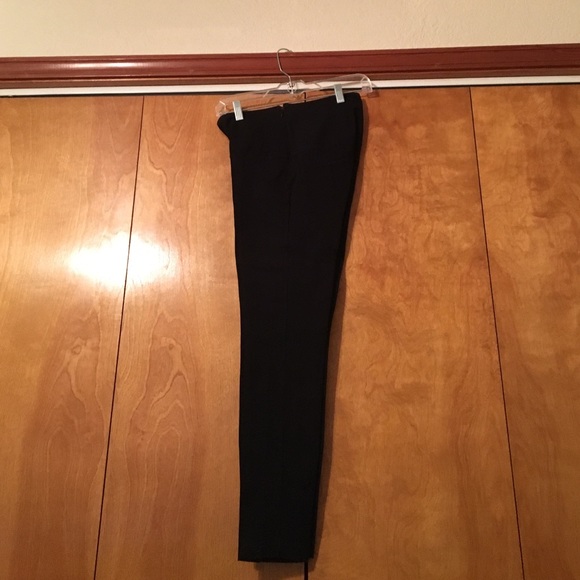 Black leggings, side zip waist.