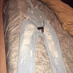 Light washed Jean overalls. Light washed Jean overalls.