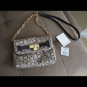 CK cross body with gold hardware & leather details