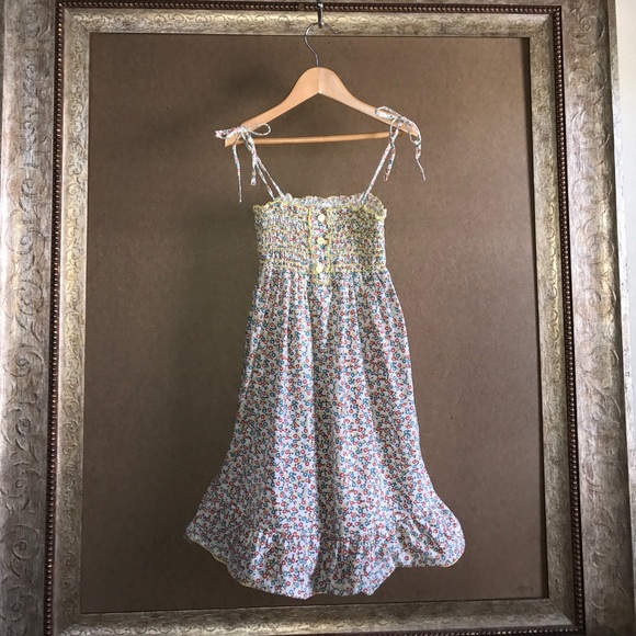 Floral sundress with smocked top & spaghetti ties.