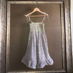 Floral sundress with smocked top & spaghetti ties.