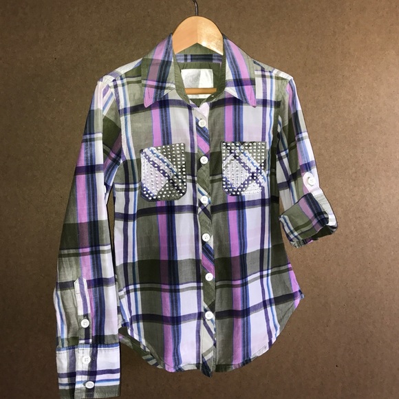 Plaid button-up, studded pockets, sleeve options.