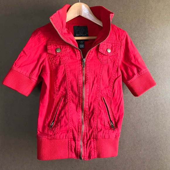 Red short-sleeved zip-up.