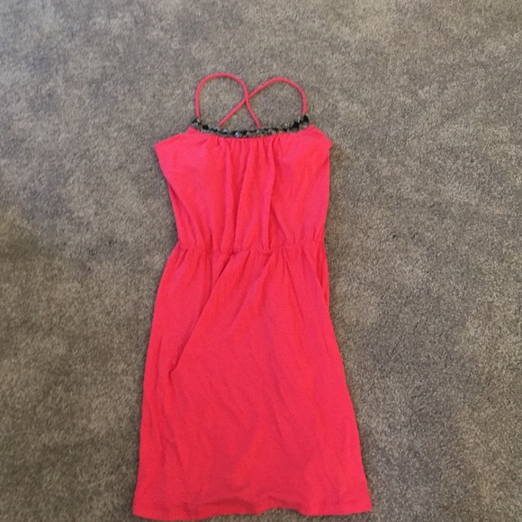 Tart watermelon mini dress with embellished neck.
